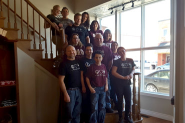 The Prairie State Winery Staff Posing for a photo on a staircase